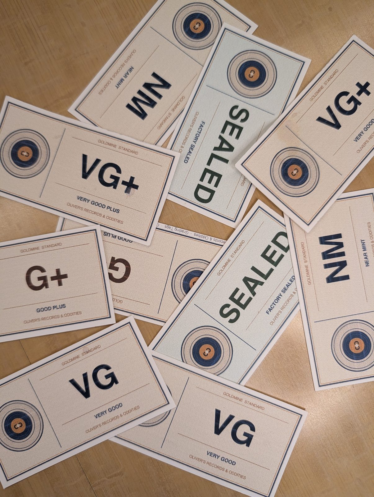 Oliver's custom record grade placards: NM, VG+, VG, G+, Sealed